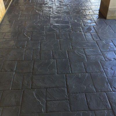 Stamped and slate-grey colored decorative concrete